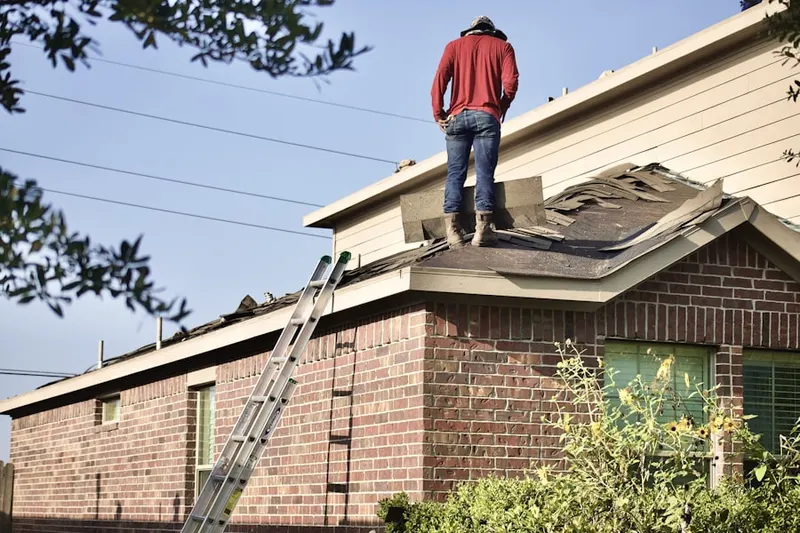 Professional roofer working on a residential roof in Norristown
